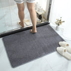 Soft plush absorbent bath mat in dark grey
