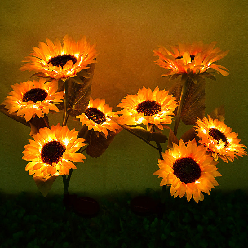 Solar sunflower garden stake light with four glowing flower heads