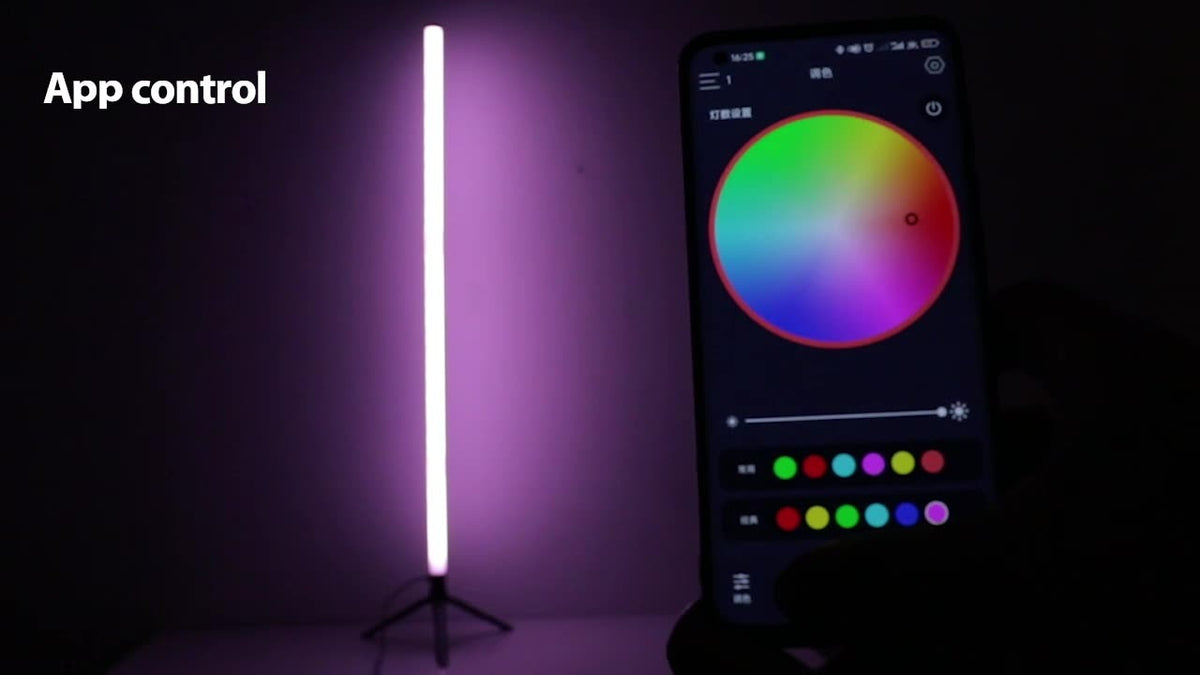 Slim RGB LED corner floor lamp on a tripod stand glowing in colour
