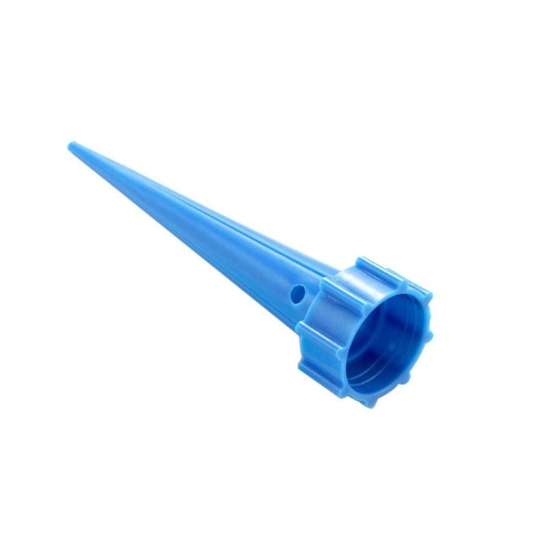 Adjustable self-watering spike attached to an upturned plastic bottle in a plant pot