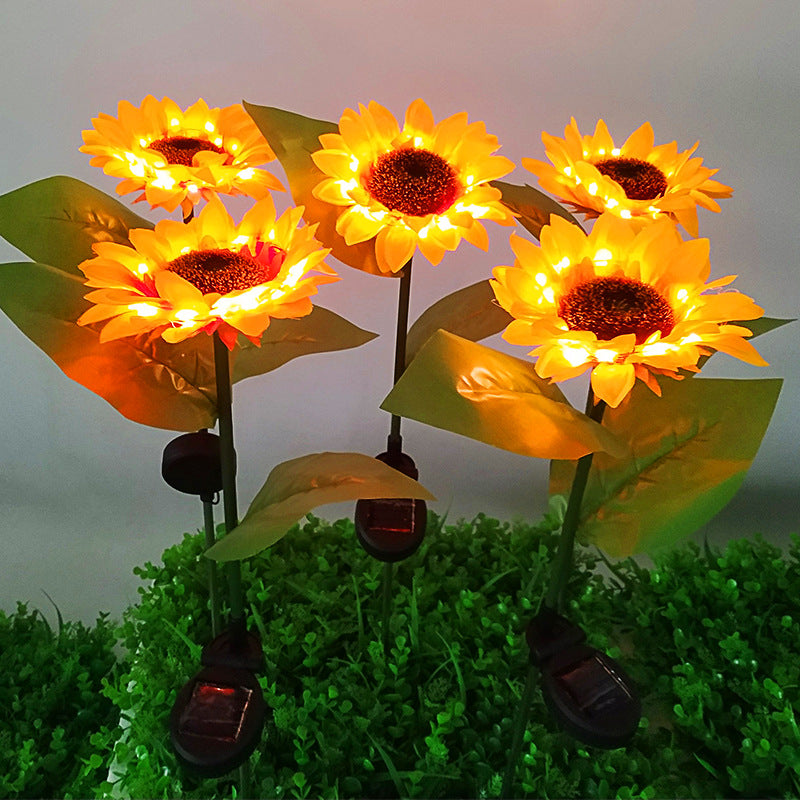 Solar sunflower garden stake light with four glowing flower heads