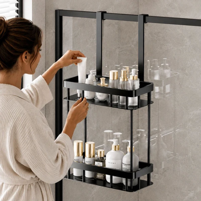 Woman placing skincare products on a black double layer shower caddy
