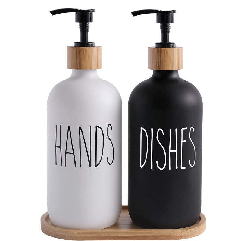 White Hands and black Dishes soap dispensers on bamboo tray