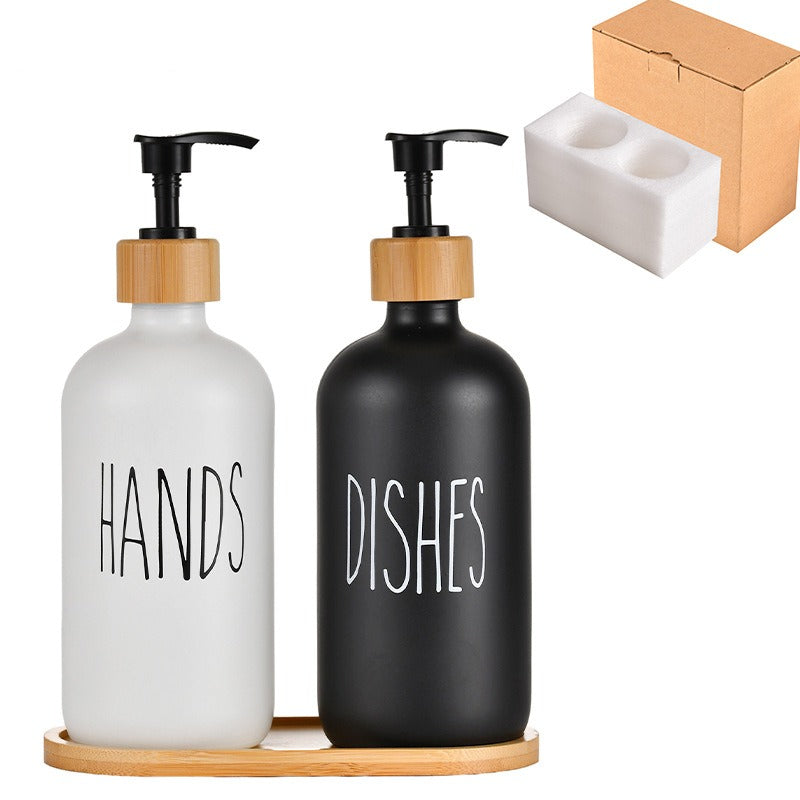 Hands and Dishes glass soap dispenser set on bamboo tray