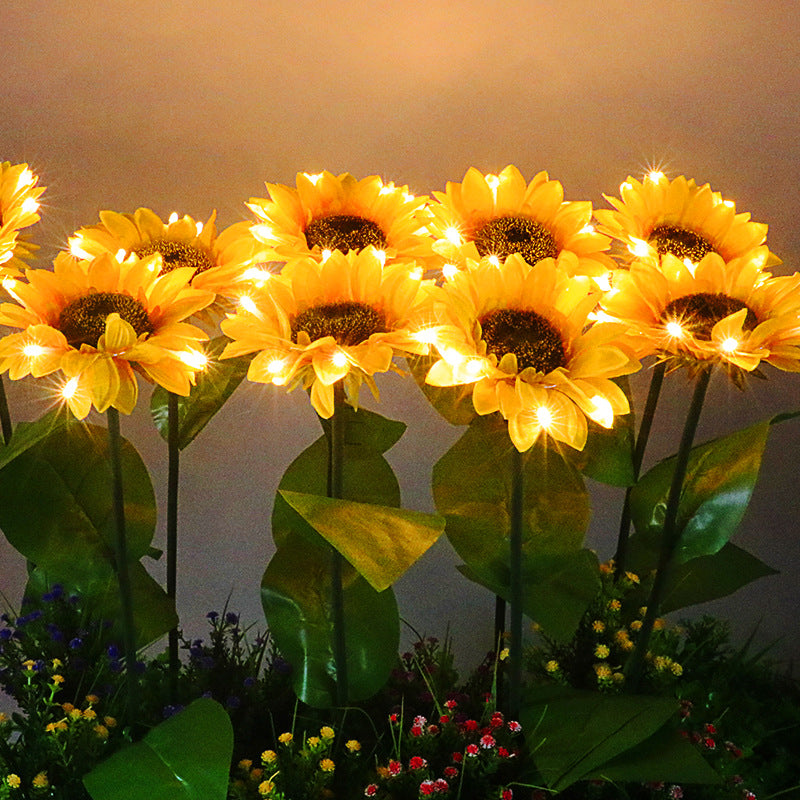 Solar sunflower garden stake light with four glowing flower heads