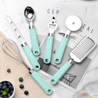 Kitchen gadgets including ice cream scoop, pizza cutter and cheese knife