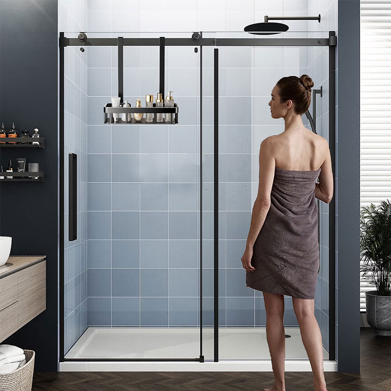 Single layer shower caddy hanging from a sliding glass shower door