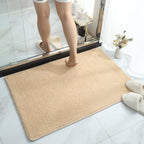 Soft plush absorbent bath mat in beige