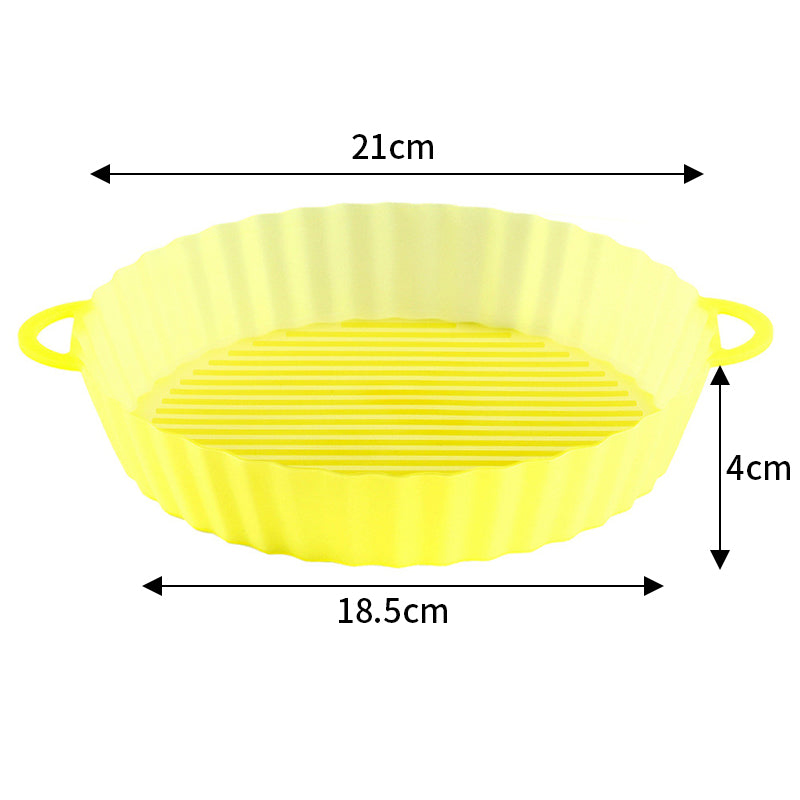 Round silicone air fryer liner with handles in yellow