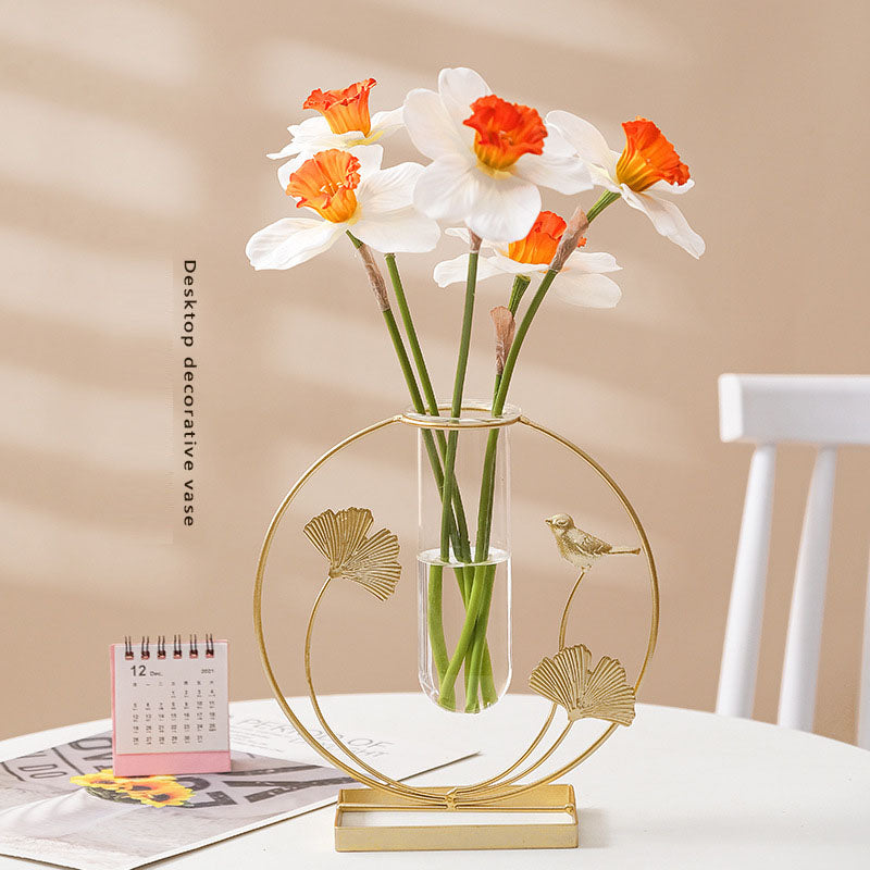 Gold ginkgo leaf and bird metal frame with a clear glass bud vase