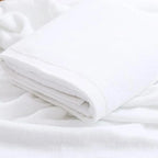 Large white cotton bath towel folded
