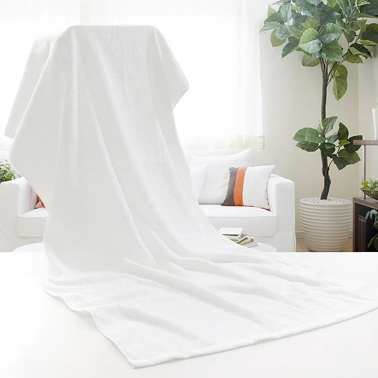 Large white cotton bath towel draped as a bath sheet
