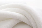 Large white cotton bath towel close-up of soft cotton loops
