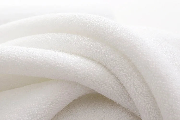 Large white cotton bath towel close-up of soft cotton loops