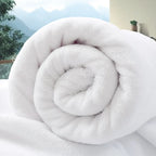 Large white cotton bath towel rolled up