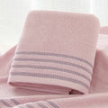 Striped cotton towel in blush pink