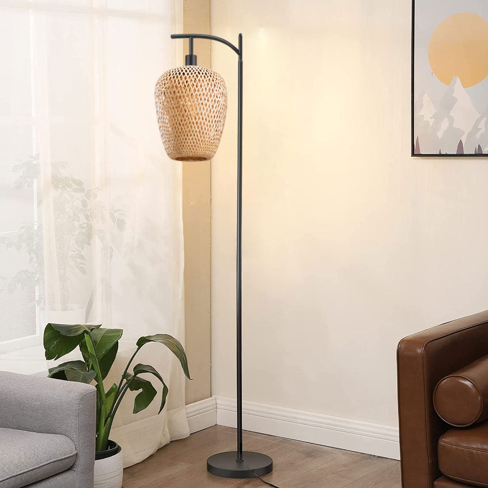 Black arc floor lamp with a hanging woven rattan-look shade