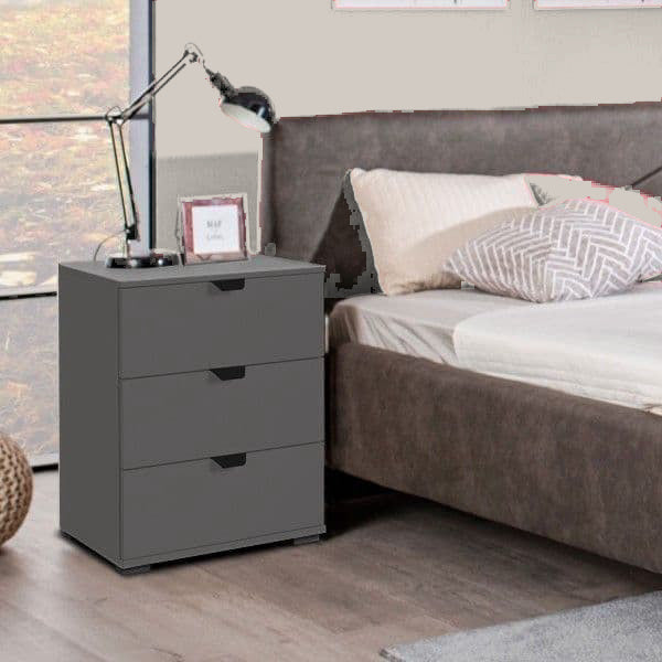 Valentina graphite grey three-drawer bedside table in a neutral bedroom